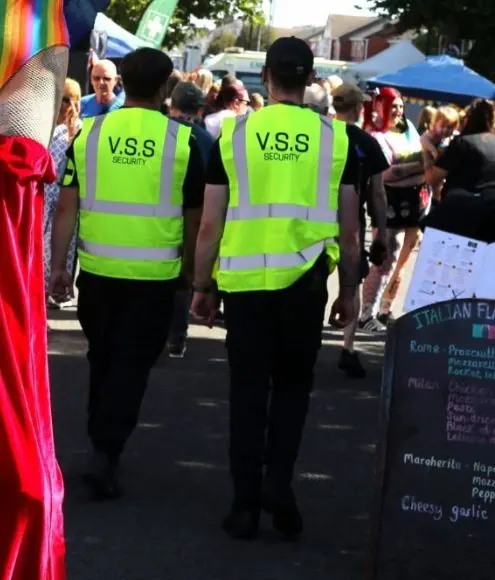 Victoria Security officers in V.S.S hi-vis vests at Wirral Pride