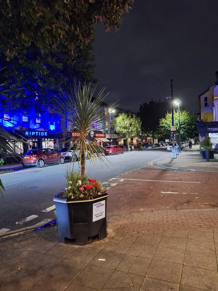 Riptide Venue lit up at night on Victoria Road, New Brighton